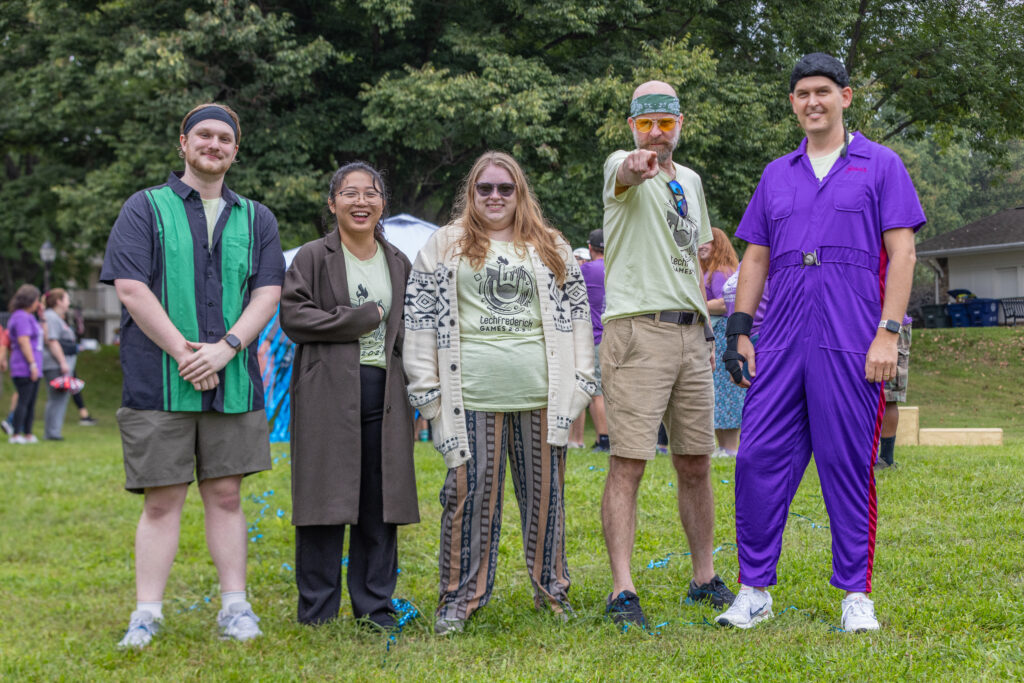 techfrederick Games team wearing 90s movie themed clothes and laughing