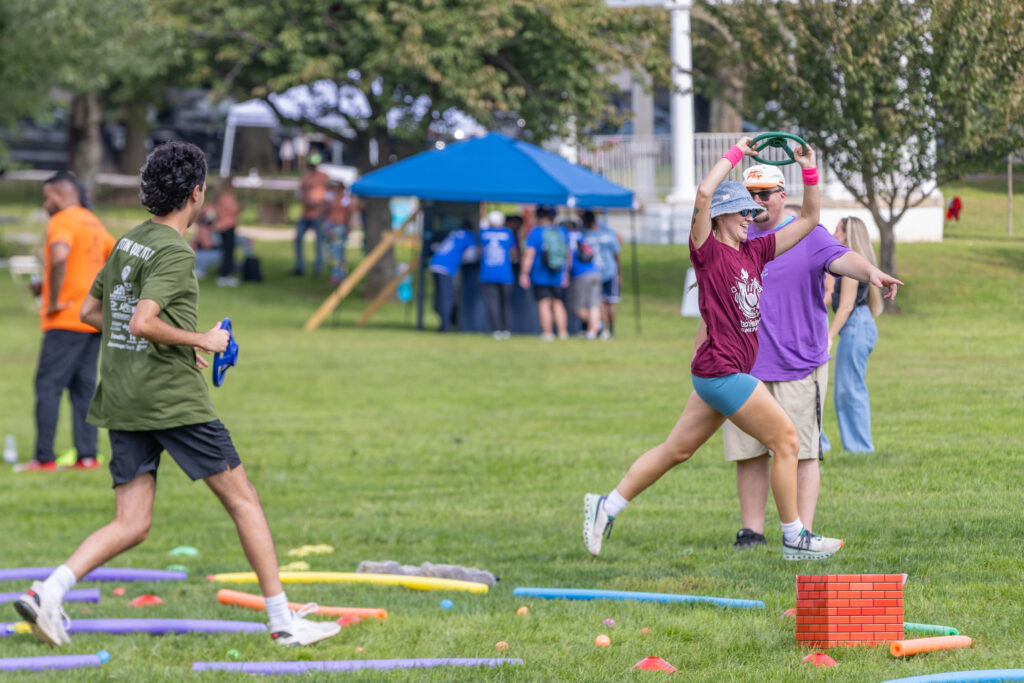 techfrederick Games participants running in a relay race