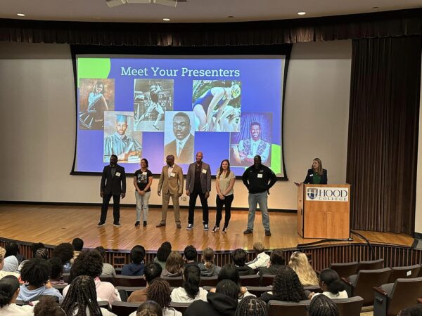 Tech Empowers presenters standing on stage